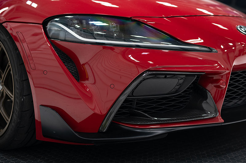 OLM LE Dry Carbon Fiber Front Side Bumper Covers installed on 2020 toyota Supra